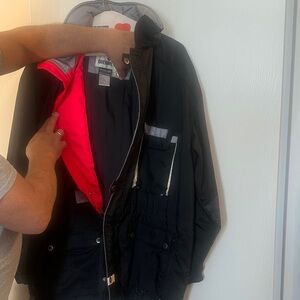 Obermeyer Black Puffer Jacket with Bright red/ orange Lining